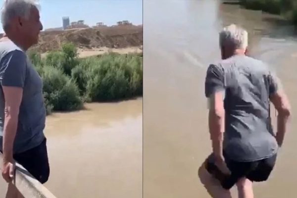 Daring Khawaja Asif jumps into canal to beat heat